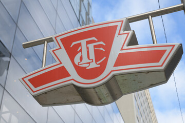 Naklejka premium Toronto Transit Commission logo sign outside entrance to St Patrick Line 1 subway station, University Av