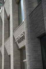Naklejka premium exterior building facade and sign of Hermès, a fashion accessories store, located at 100 Bloor St W (10 Bellair Condominium), Toronto