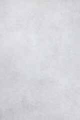 Obraz premium Soft light gray surface with subtle texture, ideal for overlays and website backgrounds. Top view. Copy space.