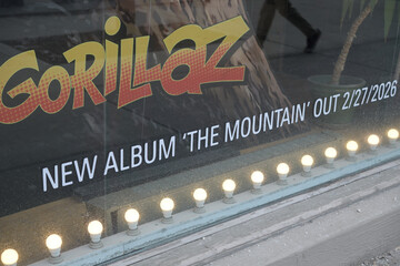 Naklejka premium Sonic Boom display window with info about album release for The Mountain by Gorillaz, at 215 Spadina Av, Toronto