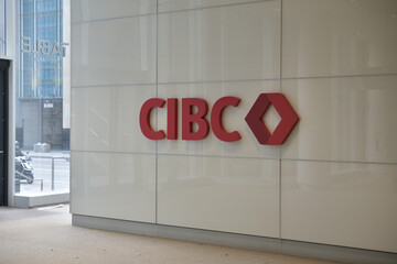 Naklejka premium Canadian Imperial Bank of Commerce sign and corporate logo inside CIBC Square, 81 Bay St, Toronto