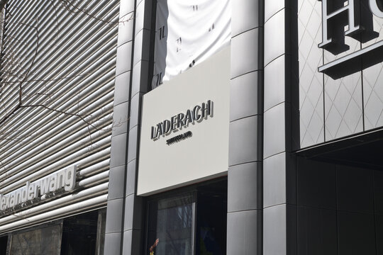 exterior building facade and signs of Alexander Wang, L&auml;derach, and Home Sense (110 Bloor W), Toronto