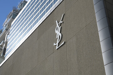 Naklejka premium exterior building facade and logo sign of Saint Laurent, a clothing store, located here at 110 Bloor St W, Toronto