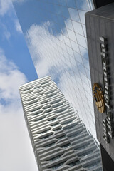 Naklejka premium skyward view of Harbour Plaza residential tower (Harbour St) and Sun Life Financial sign at One York Street, Toronto