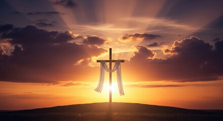 Obraz premium Wooden cross with white cloth at sunrise on hill symbolizing resurrection hope faith and spiritual renewal