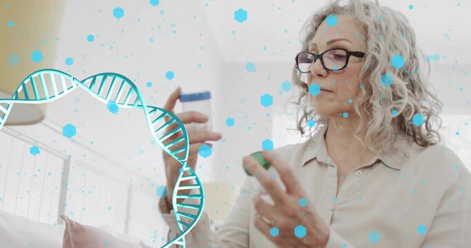 Senior woman picking bottles on couch, comparing labels to check dose, teal DNA helix floating left