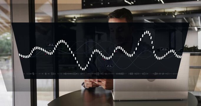 Adult man reaching phone, causing HUD waveform rising then settling over laptop for technology use