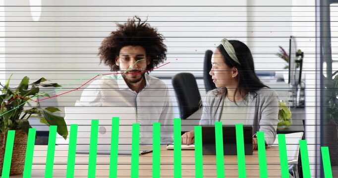 Team working at desk, woman tapping tablet and green bars rising over team showing business growth