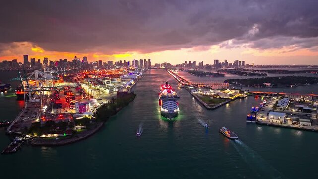 luxury cruising. Cruise ship tour and travel at sea. Cruise ship leaving Miami illuminated port. cruise ship voyage at night. cruise line. Miami port.