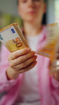 Woman counting euro bills, close-up