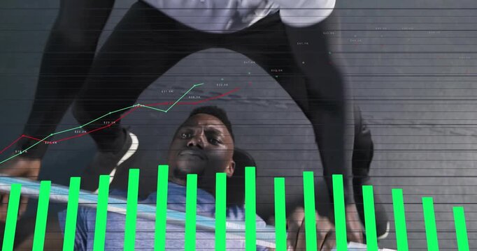 Vertical video: Lifter gripping barbell lowering and pressing while coach guiding metrics rising