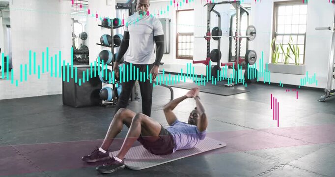 Male client rolling, tucking, crunching on mat in gym, trainer cueing, waveform guiding core reps