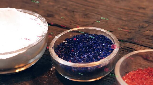 Torch flame reheating mandrel, molten tip contacting blue frit, collecting coating for glasswork