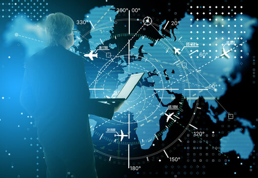 Airline dispatch operations, controller analyzes aviation data on laptop building aircraft transport routes on global radar map, coordinating flight logistics and air traffic management.