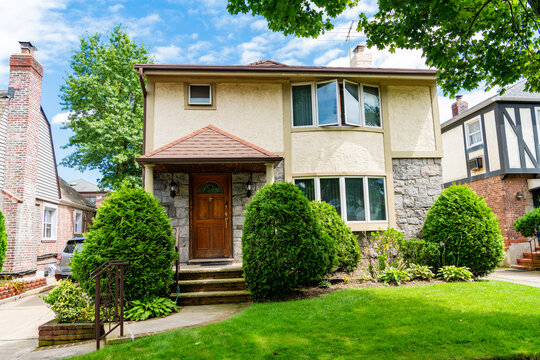 Property in neighborhood. Residential neighborhood house in developed area. Property insurance and real estate. Suburban neighborhood. Private property house. House insurance. Modern suburb