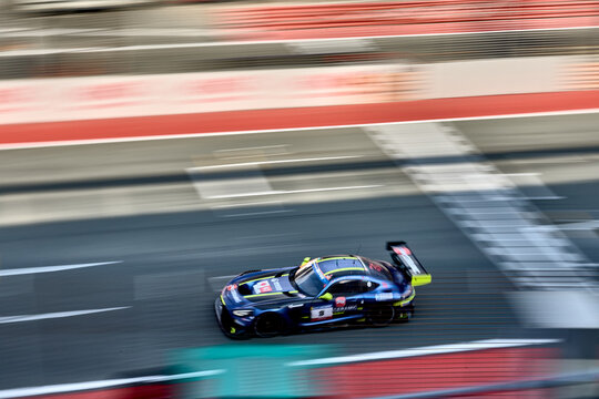 UAE, Dubai, 18 January 2026: 24h series racing supercars on the circuit, Battle of the teams, long exposure photography, supercars drive past at high speed, pitstops, training runs, watching people, 
