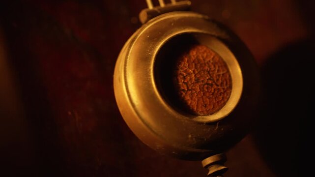 Pendulum of vintage clock swinging back and forth 