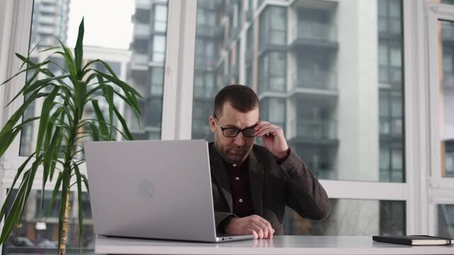 Cash counting machine processes banknotes, displaying a continuous flow of currency as it sorts and organizes bills in a financial setting with visible denominations