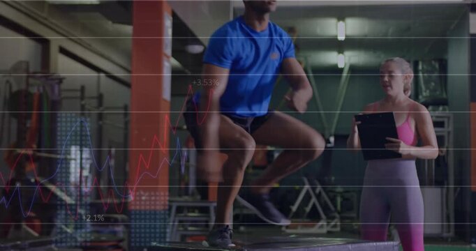 Coach cueing trainee doing box jumps and leg switches in gym while grid tracking, assessing form