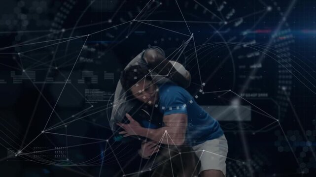 Two athletes are lifting and rotating ball carrier during tackle in dark studio with HUD overlays