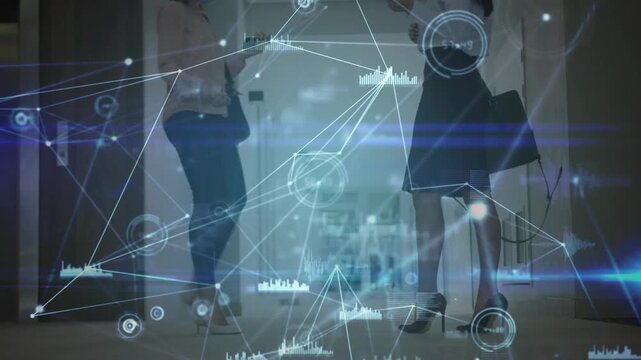 Two women meeting in hall second coming and HUD rising across bodies checking phones for business