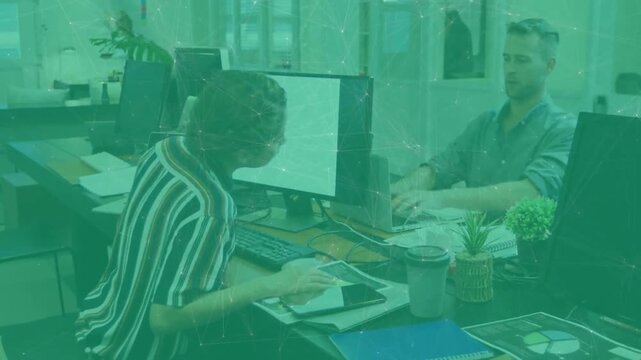 Woman tapping tablet, check popping, man giving high-five after completing business task