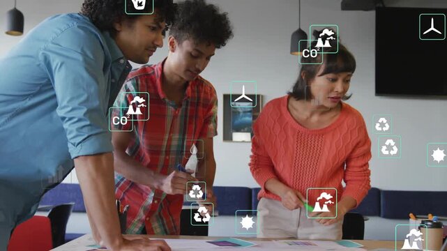 Design team reviewing prints, sorting hues and marking for design plan while overlay icons floating