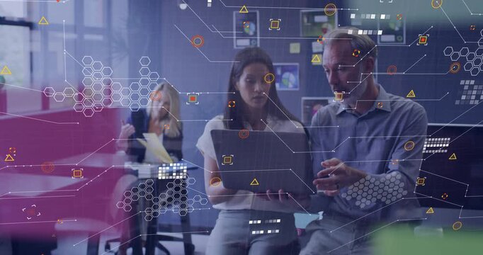 Man pointing at laptop, woman shifting laptop, HUD hexagons increasing, highlighting business data