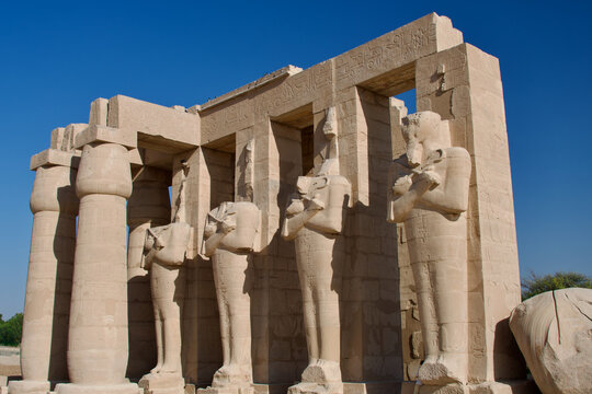 Osiris Statues and Fallen Ozymandias Colossus at Mortuary Temple of Ramesses II Thebes Necropolis West Bank Luxor Egypt