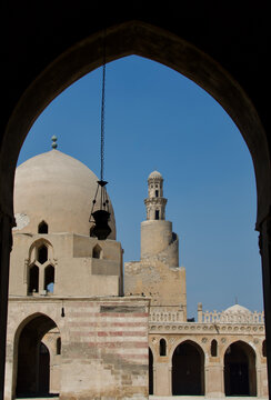 Ibn Tulun Mosque Ablution Fountain and Minaret viewed Through Courtyard Portico Arch Medieval Cairo Historic Centre Egypt