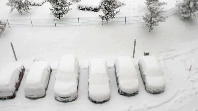 Scenic View of Snow-Covered Cars in a Parking Lot