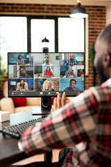 Self employed man hosts online business meeting, sharing project pitch and company vision with...