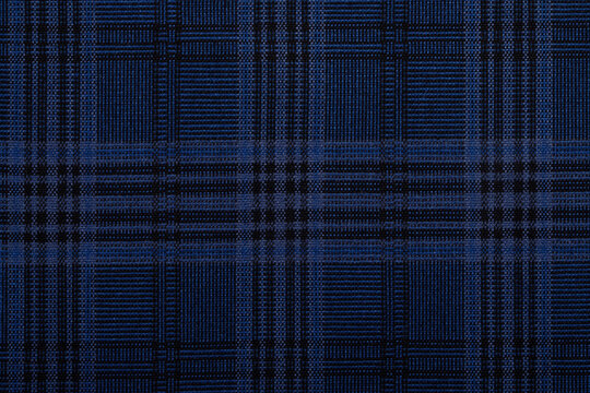 Seamless blue plaid textile pattern with intersecting dark lines, ideal for backgrounds, fashion, textiles, and design projects.