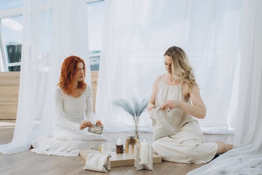 Women engaging in spiritual theta healing session