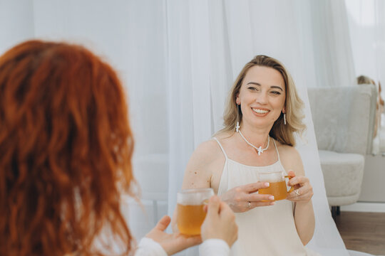 Woman smiling during theta healing consultation