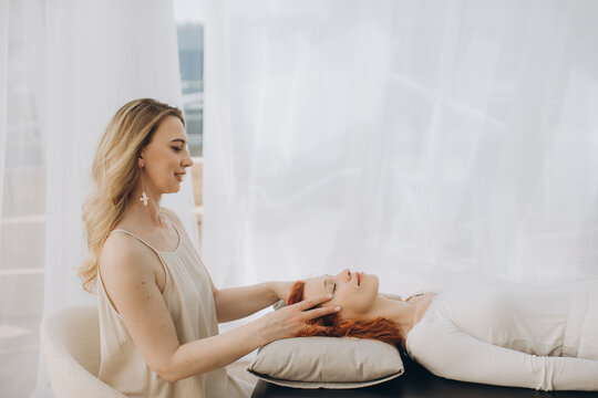 Woman performing theta healing energy session