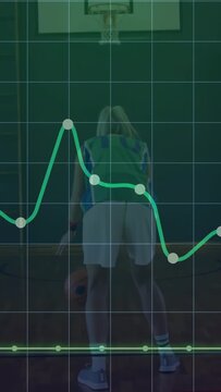 Vertical video: Player dribbling shifting and gathering ball as data line rises shooting for sports
