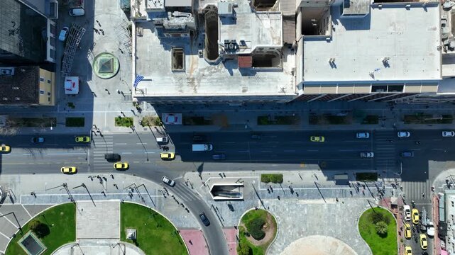 Aerial drone top down cinematic video of Athens centre dense urban landmark buildings near area of Syntagma square and Athens neoclassic trilogy in Panepistimiou street, Attica, Greece