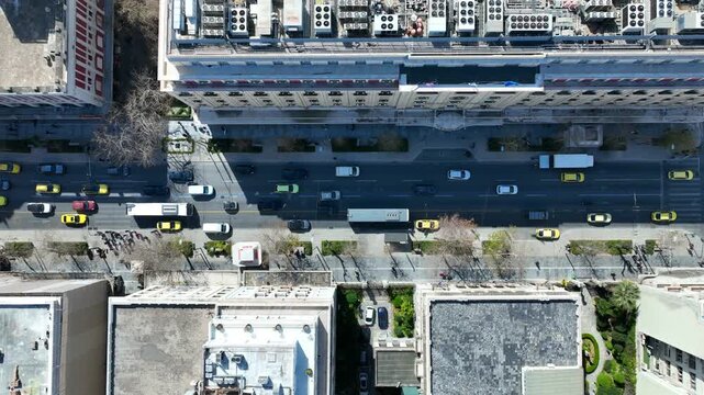 Aerial drone top down cinematic video of Athens centre dense urban landmark buildings near area of Syntagma square and Athens neoclassic trilogy in Panepistimiou street, Attica, Greece