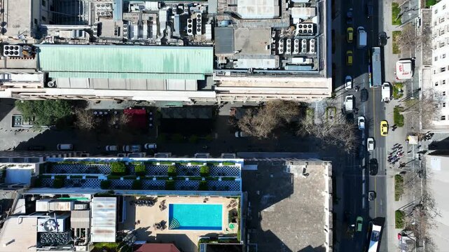 Aerial drone top down cinematic video of Athens centre dense urban landmark buildings near area of Syntagma square and Athens neoclassic trilogy in Panepistimiou street, Attica, Greece