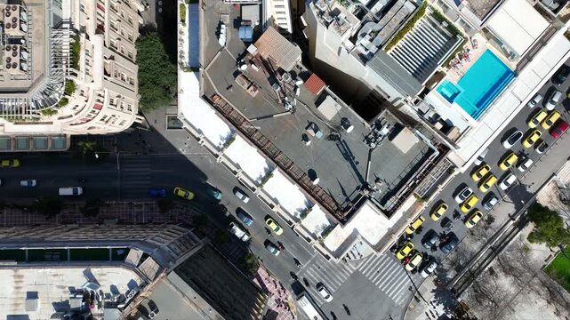 Aerial drone top down cinematic video of Athens centre dense urban landmark buildings near area of Syntagma square and Athens neoclassic trilogy in Panepistimiou street, Attica, Greece