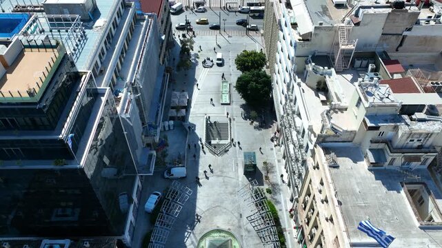 Aerial drone cinematic video of famous Korai street in front of Athens neoclassic trilogy, Academy, University and Library, Attica, Greece