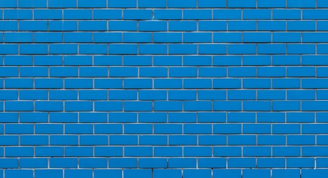 A blue brick wall with white grout