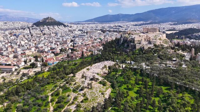 Aerial drone cinematic video of iconic Areopagus hill with great views to Acropolis and The Parthenon, Athens historic centre, Atttica, Greece