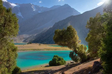 Fann Mountains Landscape in Tajikistan with Sunlit Peaks and Blue Alpine Lakes © dzmitrock87