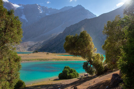 Fann Mountains Landscape in Tajikistan with Sunlit Peaks and Blue Alpine Lakes