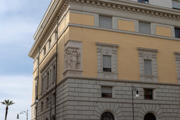 Neoclassical building facade with classical sculptures and windows © Francesco 
