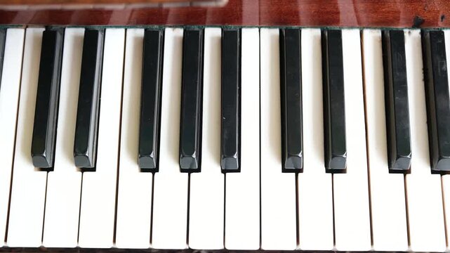 Close up of piano keys, classic musical instrument detail, white and black keys
