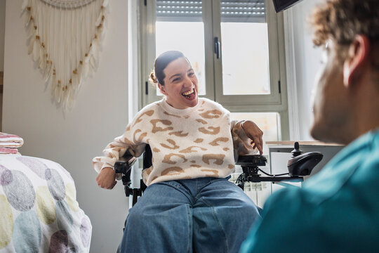 Woman with disability smiling during happy home conversation