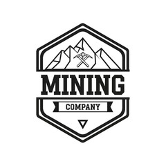 Obraz premium Mining Company Logo Design with Mountains and Tools.